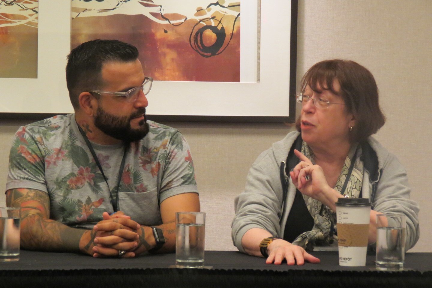 Diane and Mark Oshiro talking during a panel