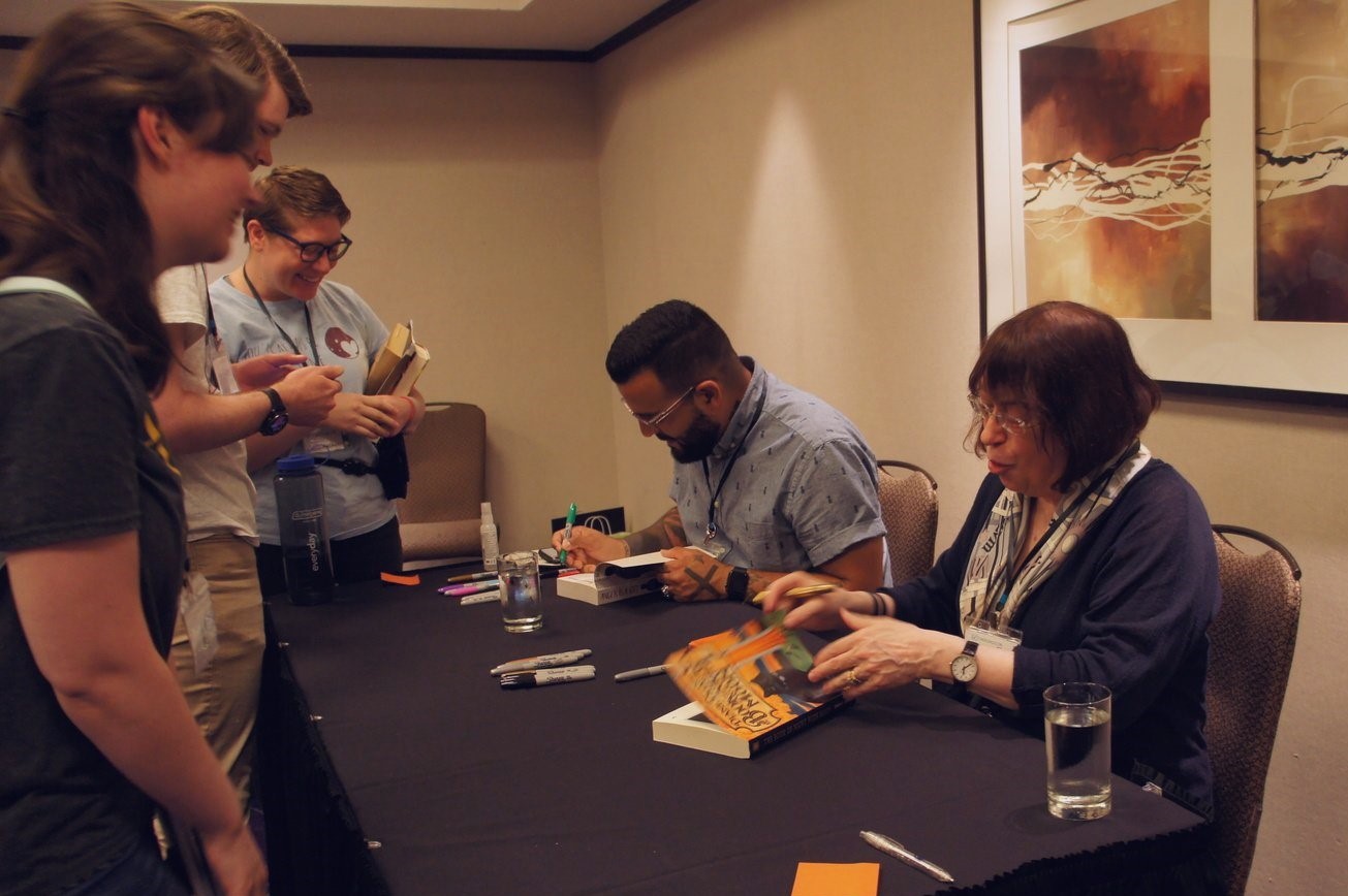 Diane and Mark signing books for attendees